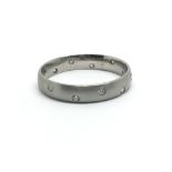 A platinum full eternity and diamond ring, having twelve small diamonds, approx size N