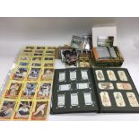 A collection of trade and cigarette cards, loose and in binders, various subjects including