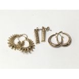 Three sets of earrings including two pairs of 9ct gold hoops and a pair in the style of ingots
