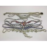 A bag of vintage diamonte costume necklaces.