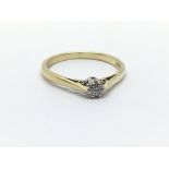 An 18ct yellow gold and diamond ring having single solitaire, ring size approx M/N