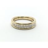 An 18ct yellow gold ring with nine square princess cut diamonds, approx 0.75ct, approx M/N