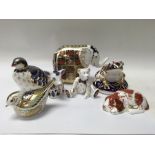 A collection of royal crown derby weight with gold stoppers.