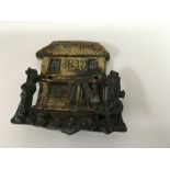 A 19 th century 1837 cold painted door knocker in the form of a couple entering a cottage.
