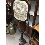 A Victorian mahogany Pole fire screen Inset with peacock and floral panel.