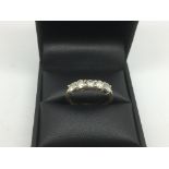 An 18ct gold ring set with a row of five brilliant cut diamonds, approx 3.8g and approx size N.