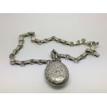 A Victorian silver locket on a collar chain, approx 35g.