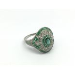 An Art Deco style platinum, emerald and diamond dr