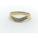 An 18ct yellow gold wishbone shaped ring having a row of seven diamonds, approx 0.25ct, ring size