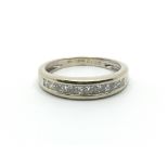 An 18ct white gold half eternity ring having princess cut diamonds, approx 0.52g, ring size approx
