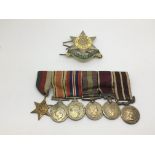 A set of six WW2 dress medals and a Burma Star badge.