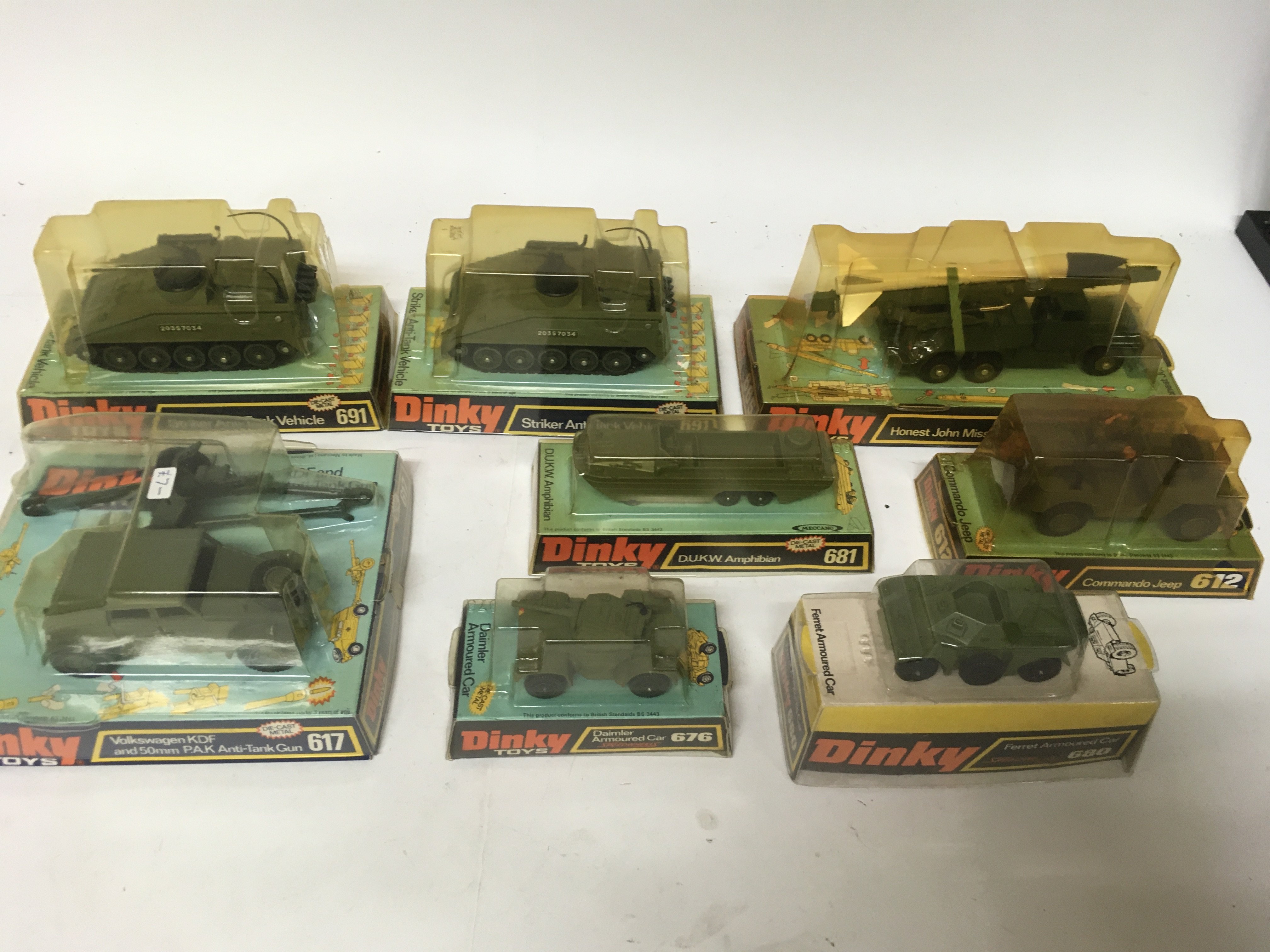 Dinky toys, Military #691 Striker anti tank vehicle x2, #665 Honest john missile launcher, #617