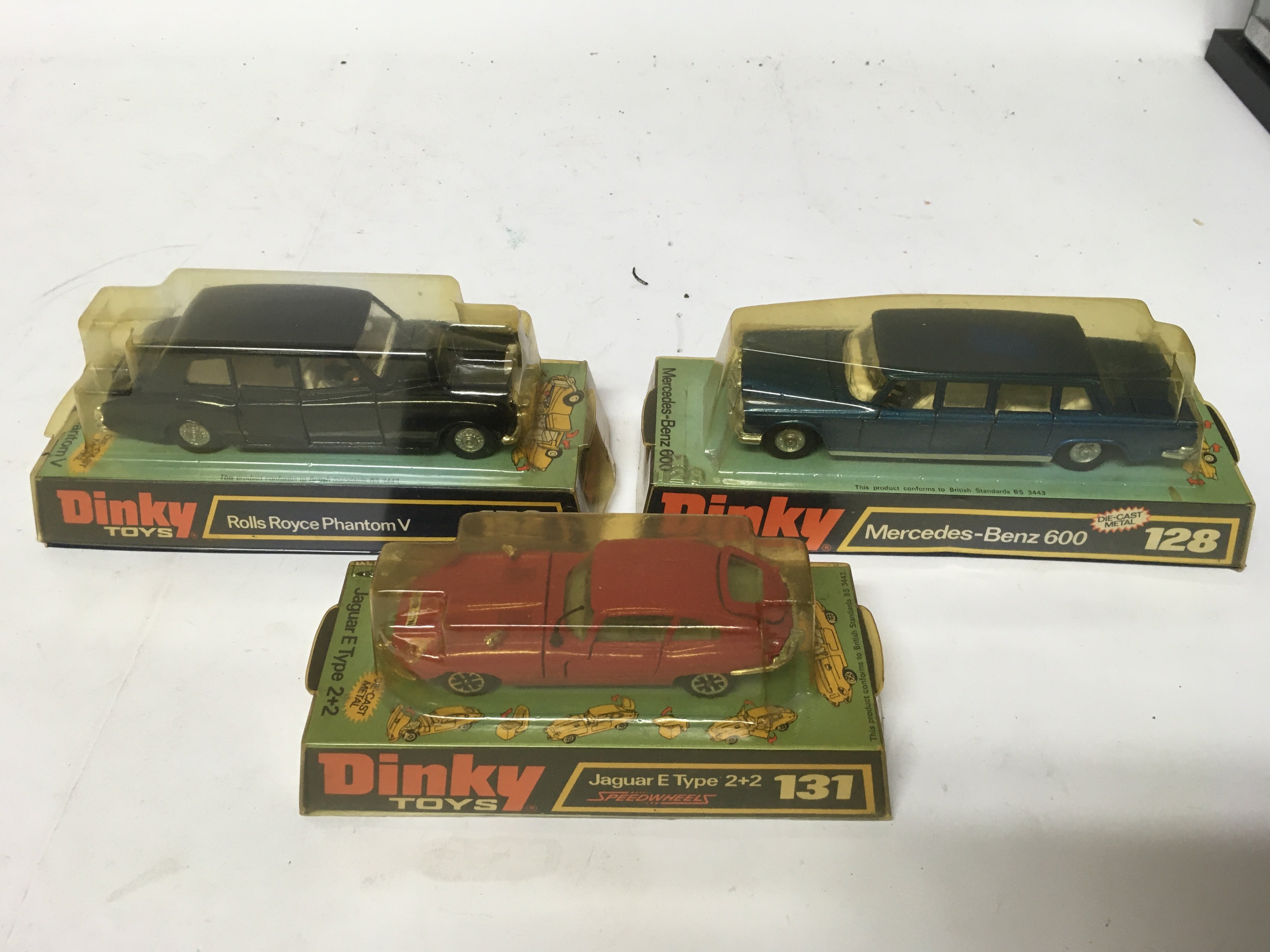 Dinky toys, #128 Mercedes Benz 600, #131 Jaguar e type 2+2 and #152 Rolls Royce phantom V, boxed