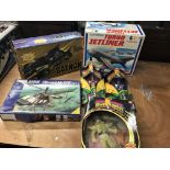 A box containing boxed toys including a Batmobile, 3x Power ranger figures, a Revell helicopter