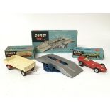 Corgi toys, #100 Dropside trailer, #150 Vanwall F1 racing car and #1401 Elevating service ramp,