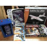 A collection of boxed toys including R/C planes, 3x pellet guns , Steel tec construction kit and a