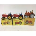 Dinky toys, #300 Massey Harris tractor x2 and #301 Field Marshall tractor, boxed