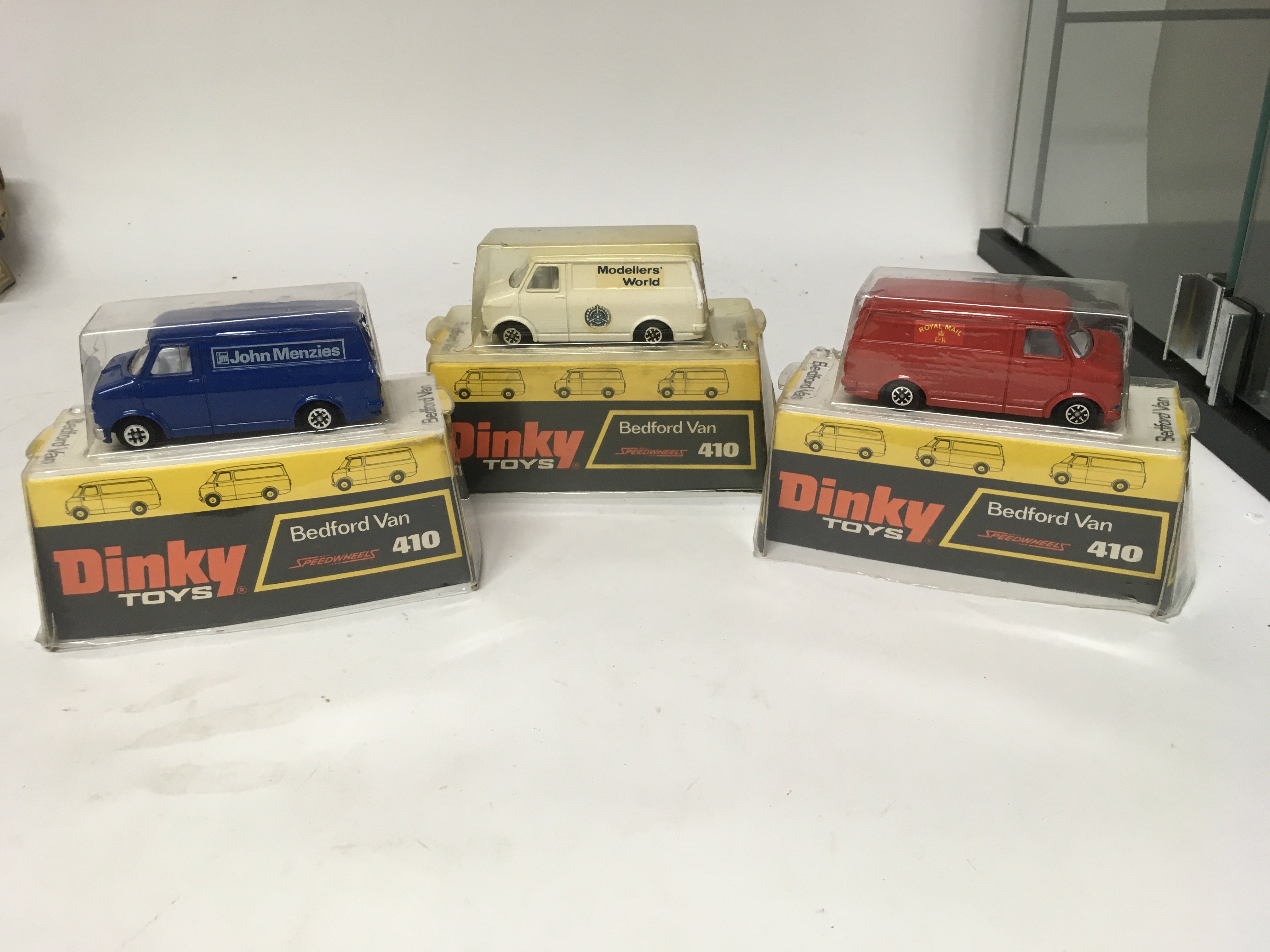 Dinky toys, #410 Bedford van x3 John Menzies, Modellers world and Royal Mail, boxed