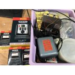 A box containing a collection of railway electrical accessories including digital select and