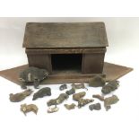 An antique wooden ark and animals.