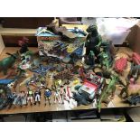 A collection of dinosaurs and Jurrasic Park figures and Dino riders etc