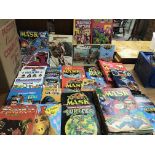 A box containing a collection of Annuals , books and comics of Mask, Turtles, Visionaries and