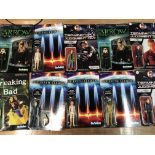 A collection of Re-Action carded figures, includin