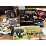 A box containing various board games and puzzles e