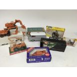 A collection of boxed toys including Atlas Diecast, Britain's motorcycle, Siku Rescue van, Shinsei