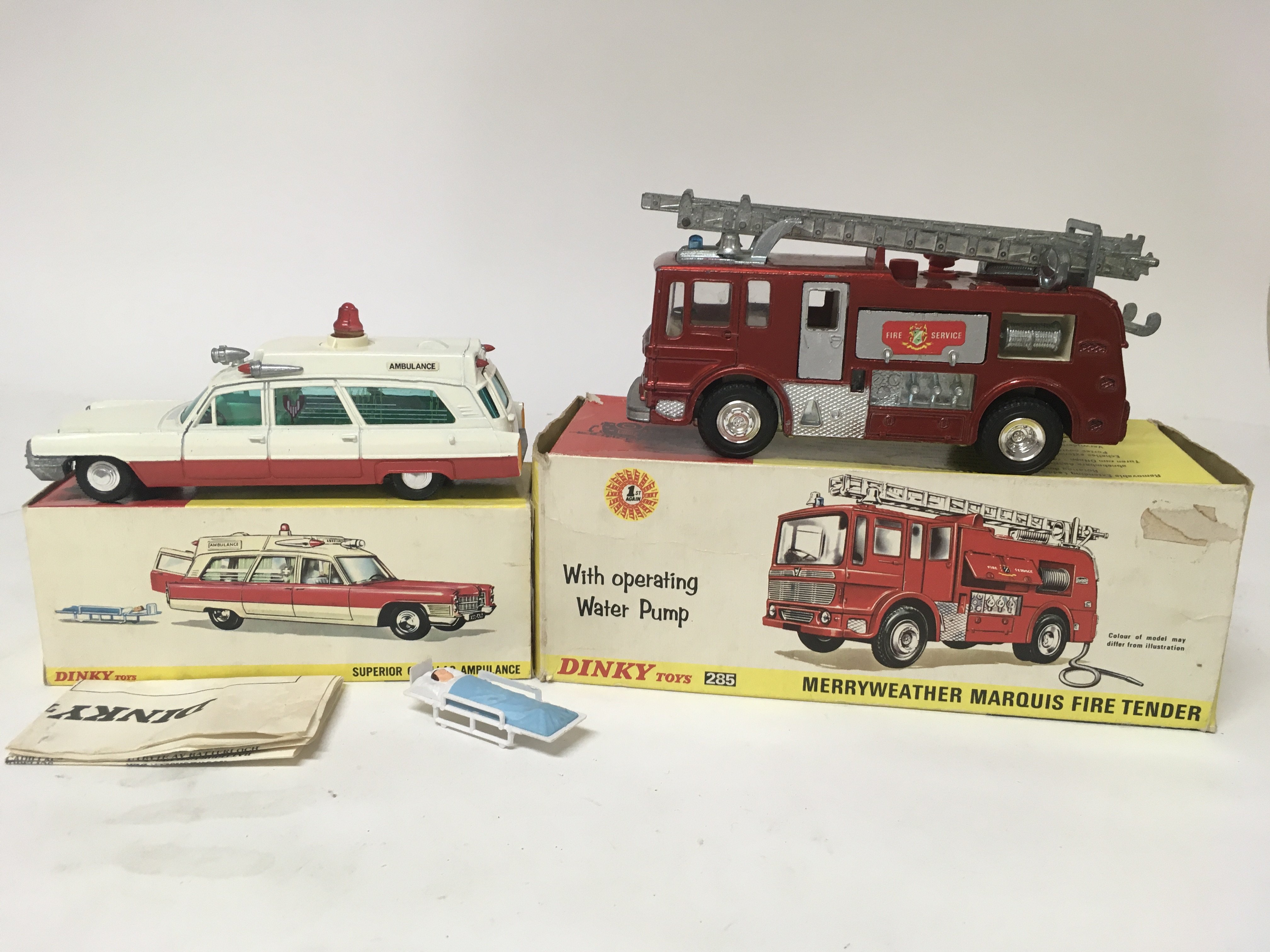 Dinky toys, #267 Superior Cadillac Ambulance and #285 Merryweather Marquis fire tender, boxed