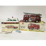 Dinky toys, #267 Superior Cadillac Ambulance and #285 Merryweather Marquis fire tender, boxed
