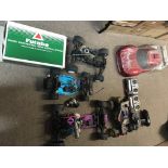 A box of R/C petrol and battery operated vehicles, mainly good for spares