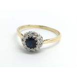 An 18ct yellow gold sapphire and diamond cluster r