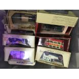 A small collection of yesteryear boxed cars .