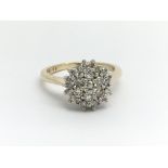A 9ct yellow gold and diamond cluster ring, approx