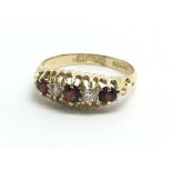 A vintage 18ct yellow gold ring with alternating g