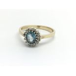 A 9ct yellow gold, topaz and diamond cluster ring,