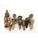 A collection of 1950s novelty corks.