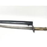 A French 1869 pattern bayonet with a brass grip.