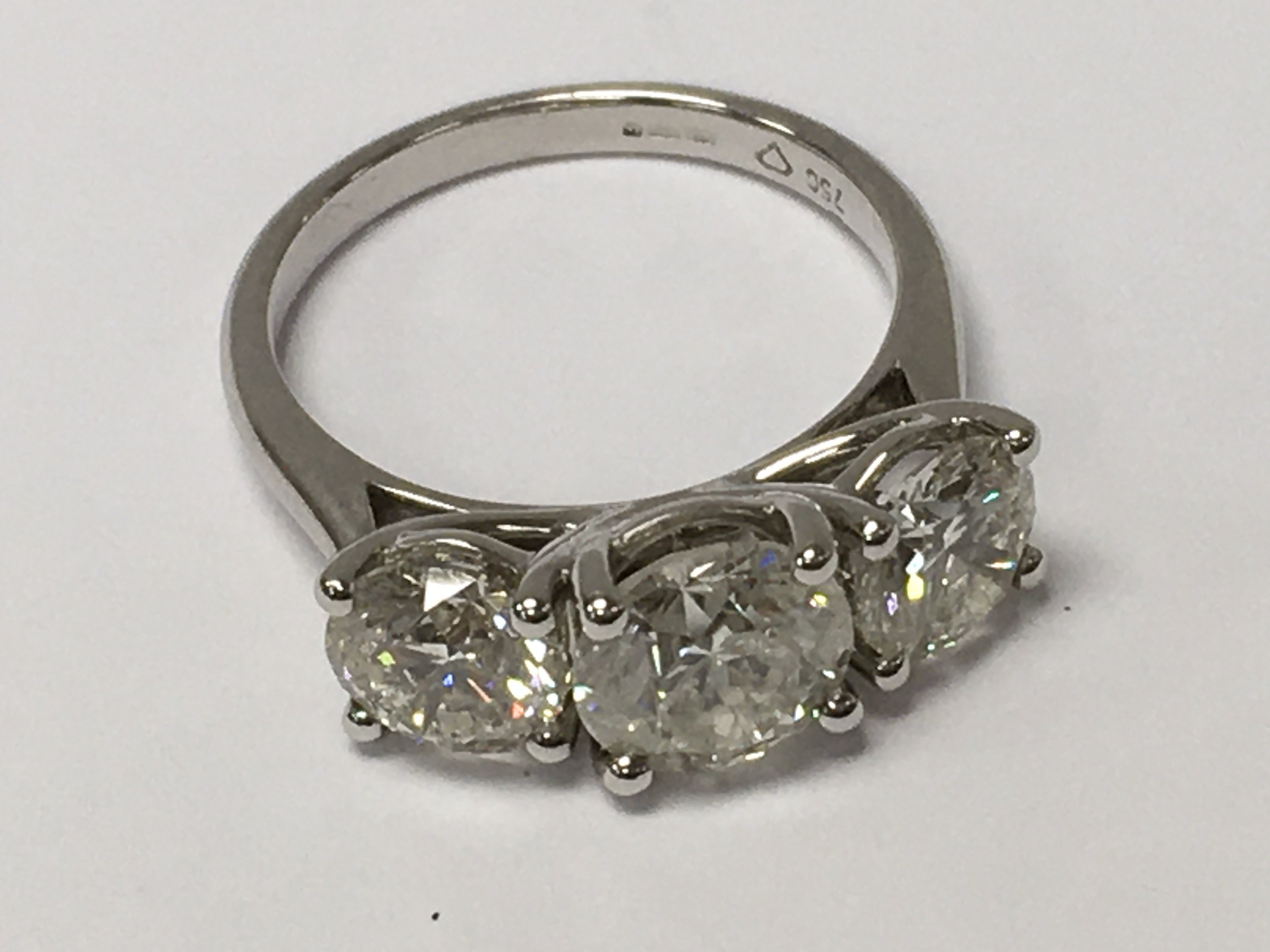 An 18ct white gold large 3-stone diamond ring. RBC