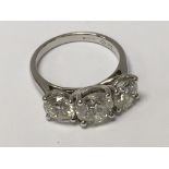 An 18ct white gold large 3-stone diamond ring. RBC