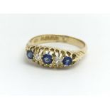 A vintage 18ct yellow gold ring having three sapph