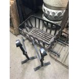 A cast iron fire basket together with 2 wrought ir