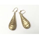 A pair of 9ct gold shell shaped earrings