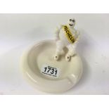 A small porcelain ash tray with figure of Michelin