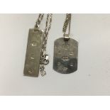 Two sterling silver ingots on silver chains .