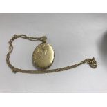 A 9 ct gold locket on chain 11 grams .