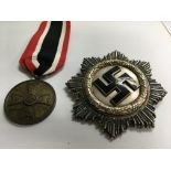 A German style 1941 cross badge and a German civil