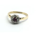 An 18ct yellow gold ruby and diamond cluster ring,