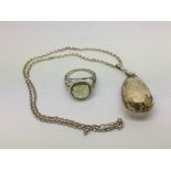 A large citrine and silver pendant on chain plus a